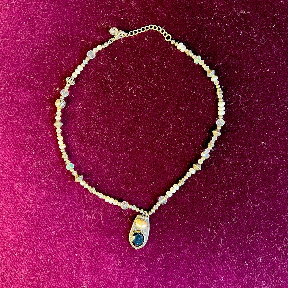 Freshwater pearl, crystal and onyx necklace with sterling silver accents.